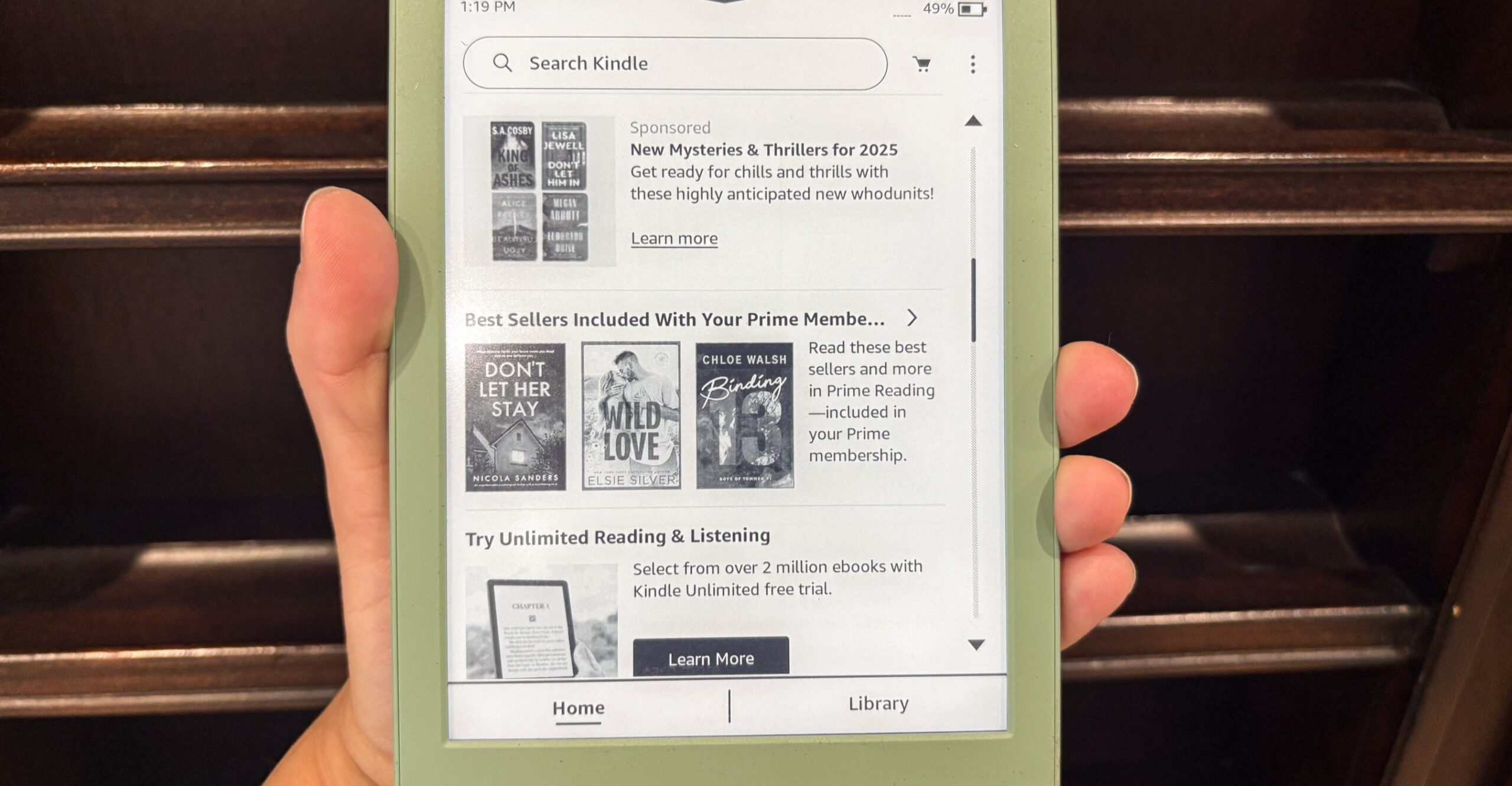 A hand holding the 2024 Kindle.