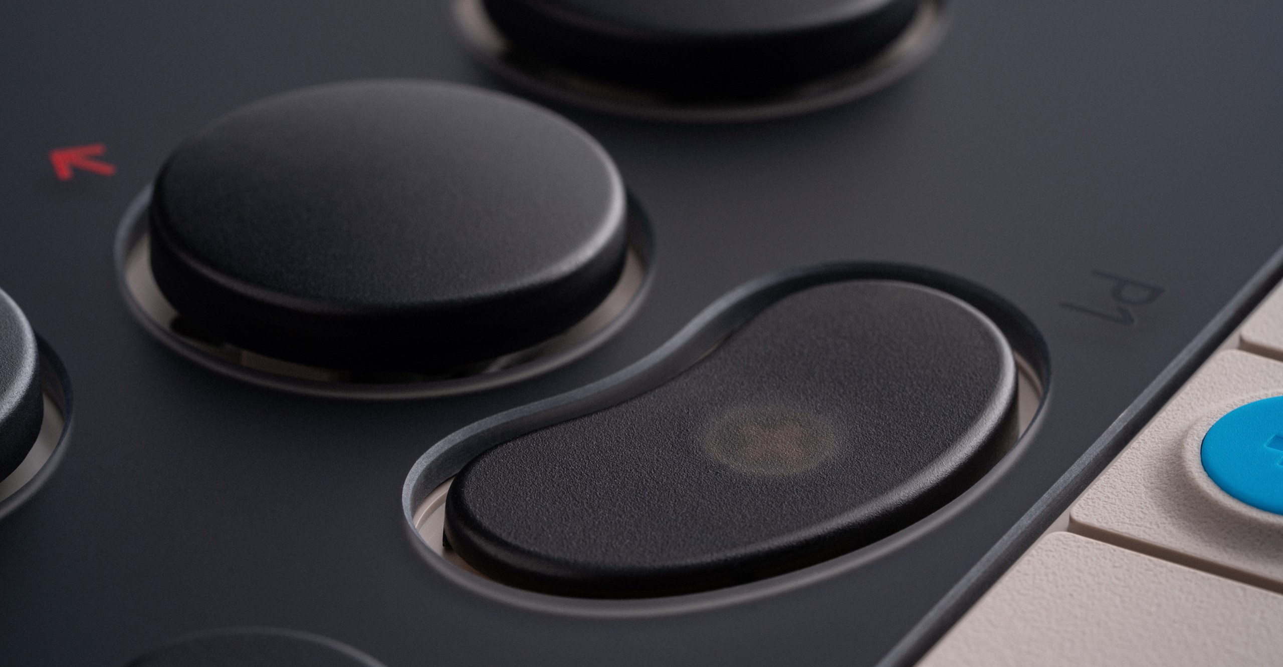 A close-up of one of the the 8BitDo leverless Arcade Controller’s programmable buttons.