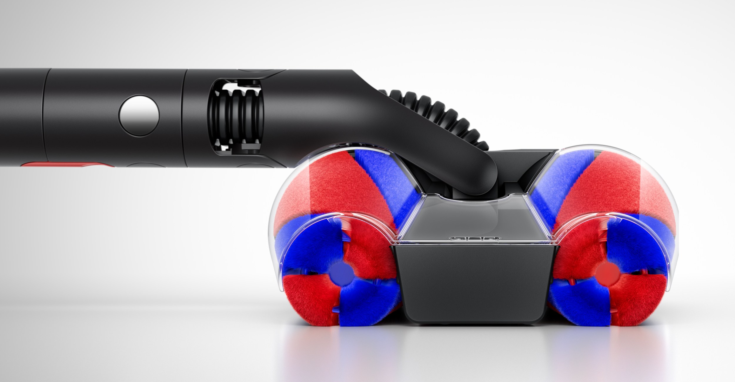 A close-up of the Dyson PencilVac lying very close to the floor.