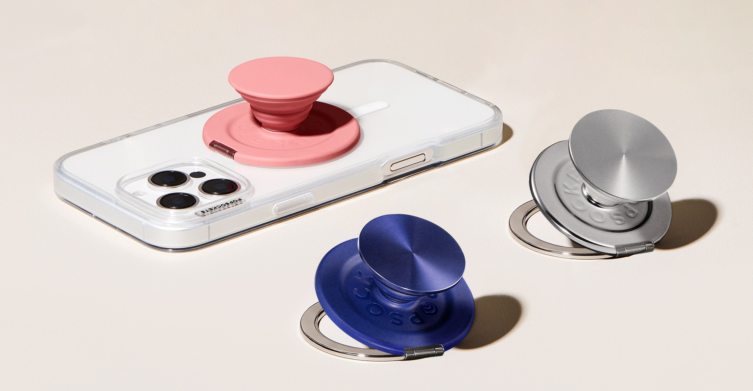 PopSockets’ new Kick-Out Grip and Stand attached to a smartphone and on their own.
