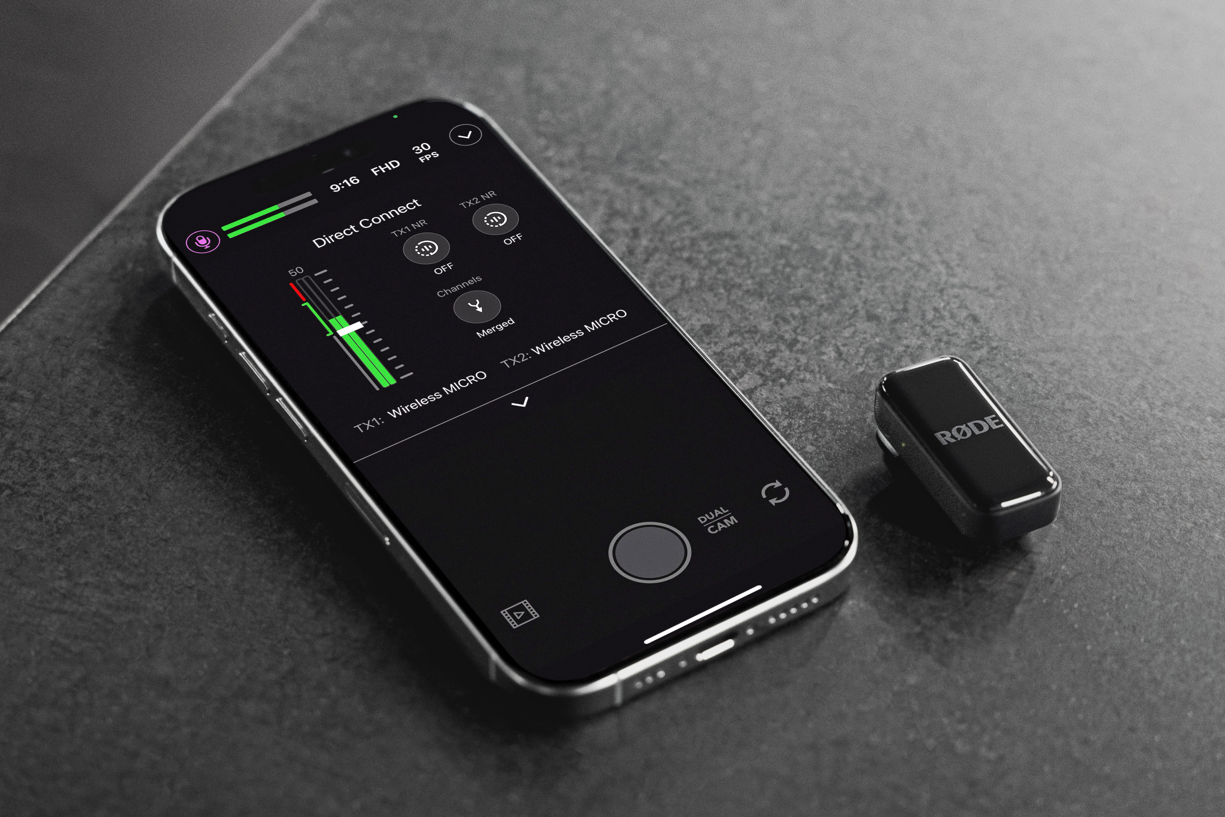 A Rode Wireless Micro microphone next to an iPhone running Rode’s recording app.
