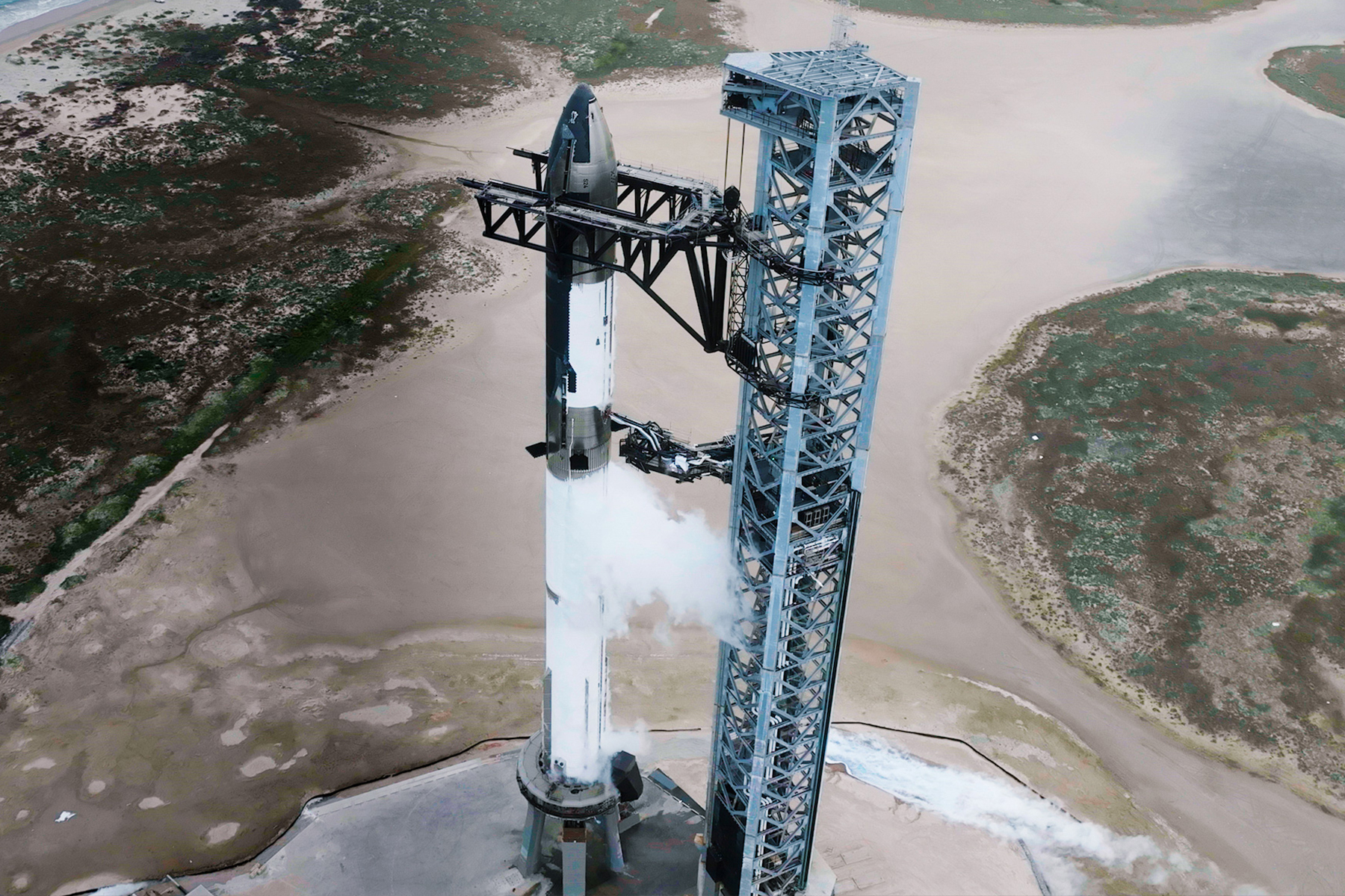 SpaceX’s Starship spacecraft and Super Heavy rocket on the launchpad at Starbase.