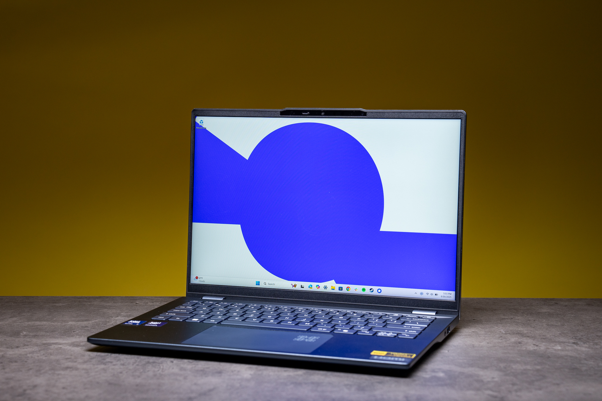 An Acer Swift 14 AI laptop in blue, against a yellow background on a gray table.