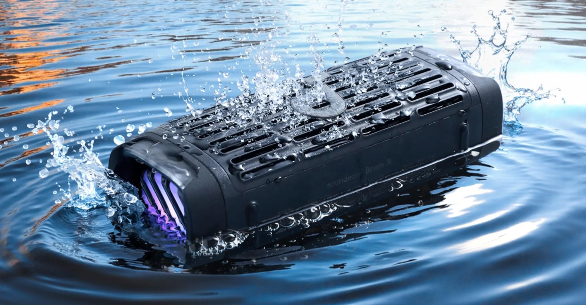 The Anker Boom 3i wireless speaker floating in a lake.