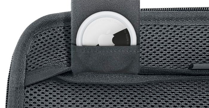 An Apple AirTag inserted into a small pocket on Belkin’s Switch 2 charging case.