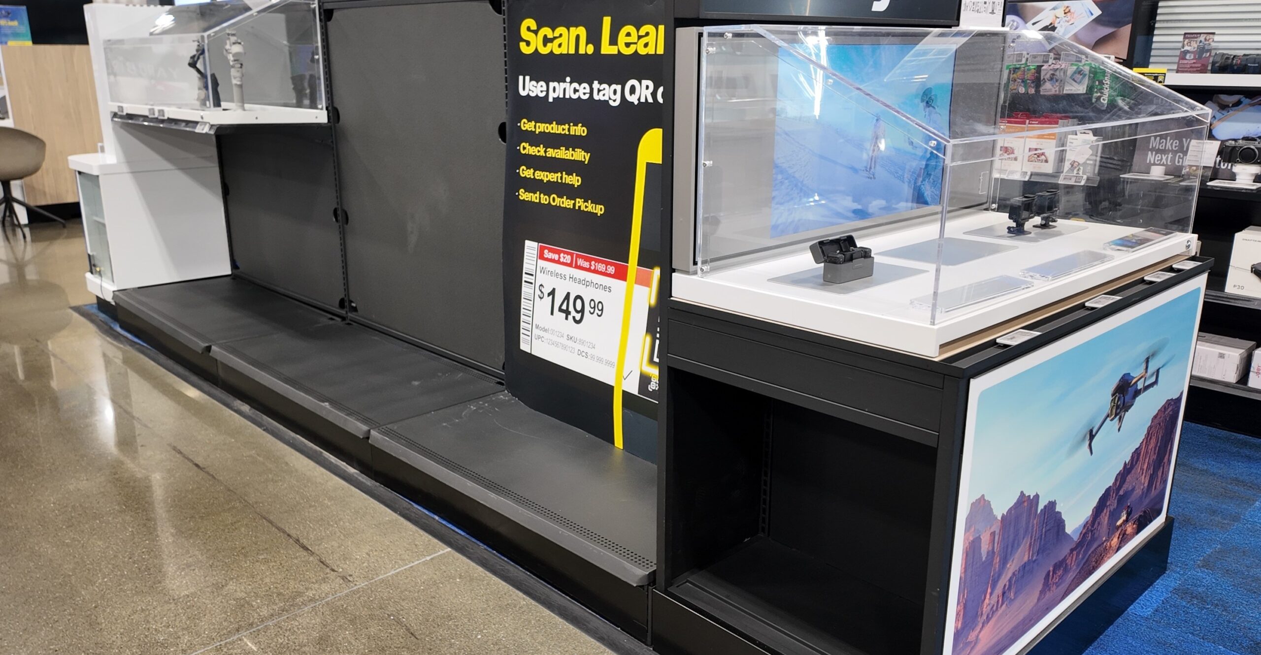 Empty shelves, missing price tags and lockers in the DJI section of Best Buy.