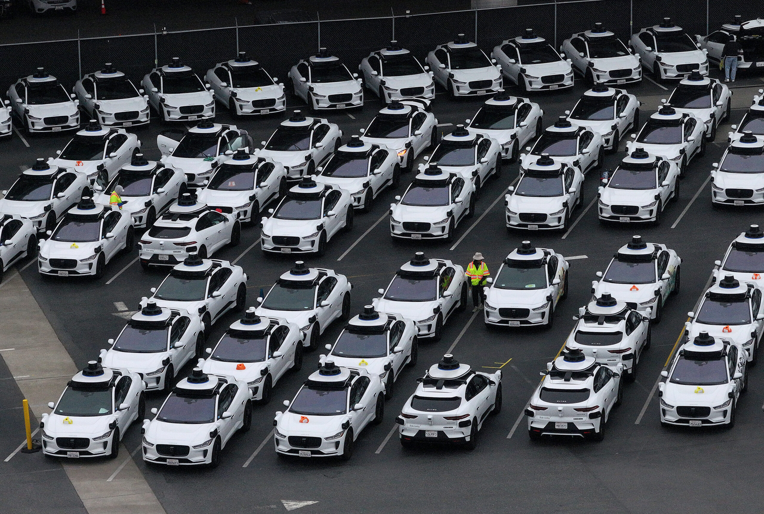photo of dozens of Waymo vehicles