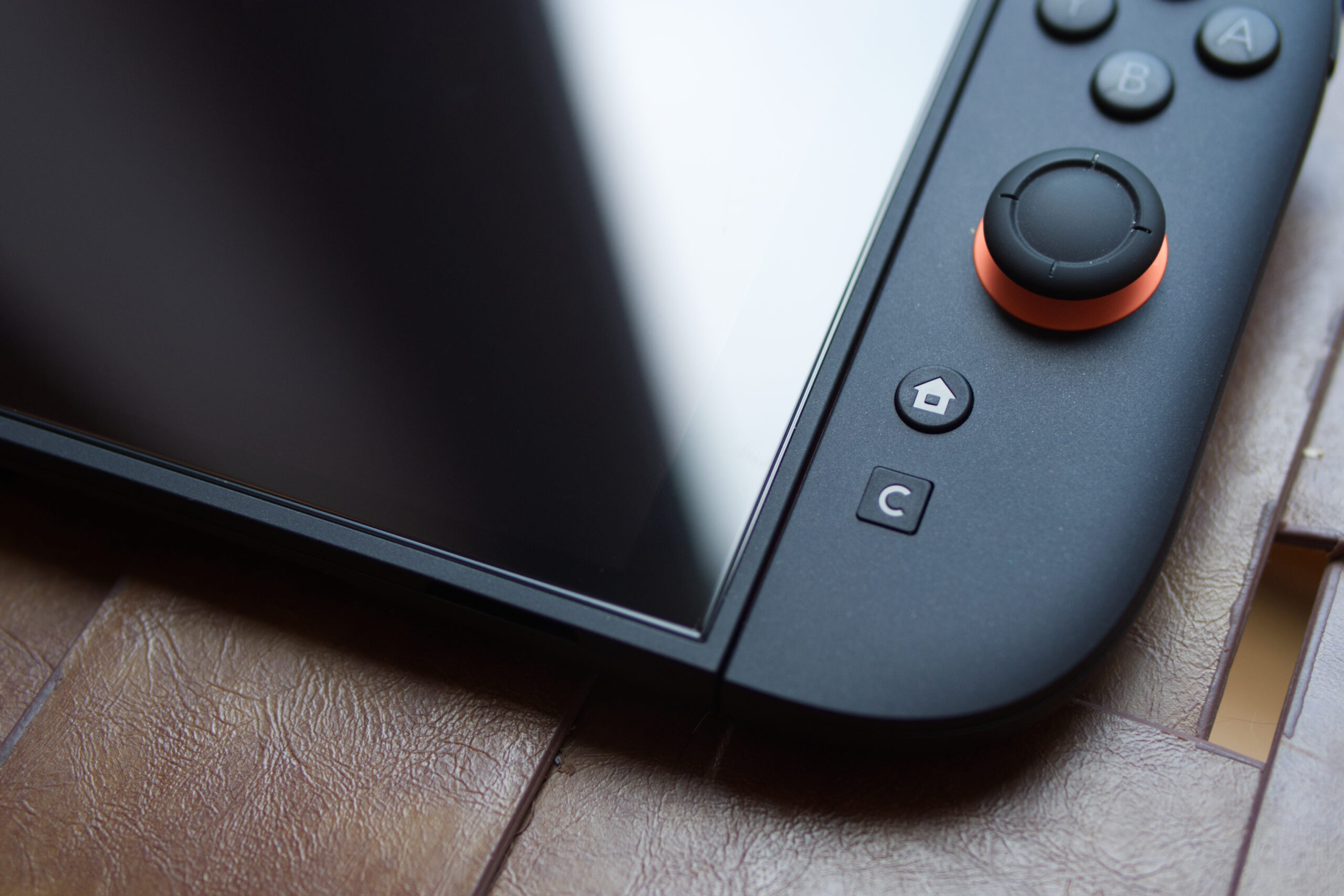 An image focusing on the Nintendo Switch 2, specifically where the right Joy-Con 2 meets the console. 