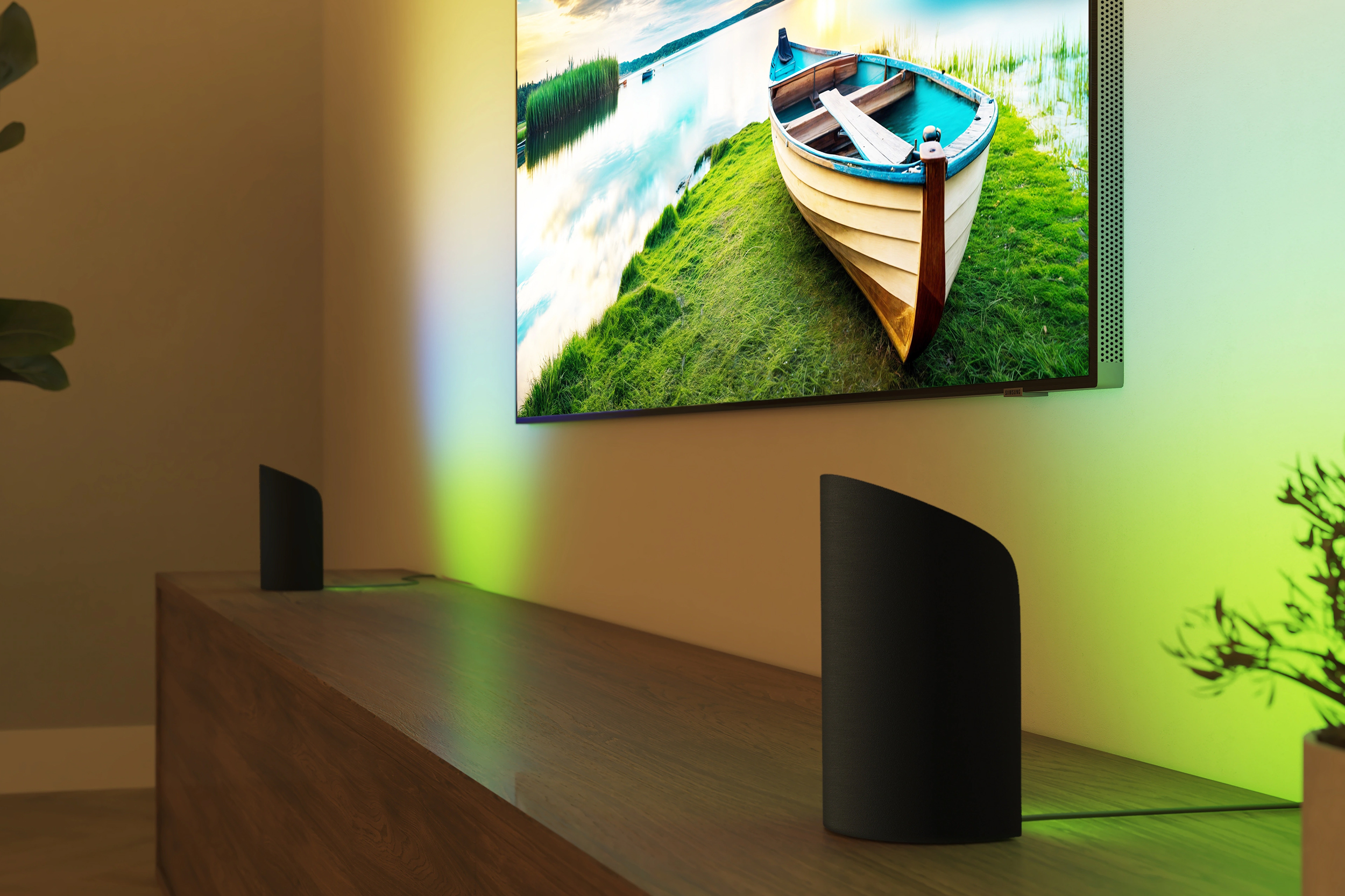 Two Philips Hue Play Wall Washer lights projecting colored light on the walls surrounding a TV.