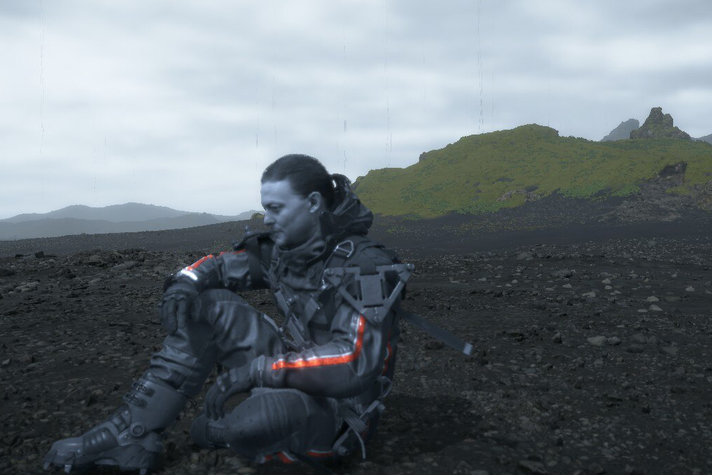 An image of Sam Porter Bridges sitting on the ground. His skin is grey.