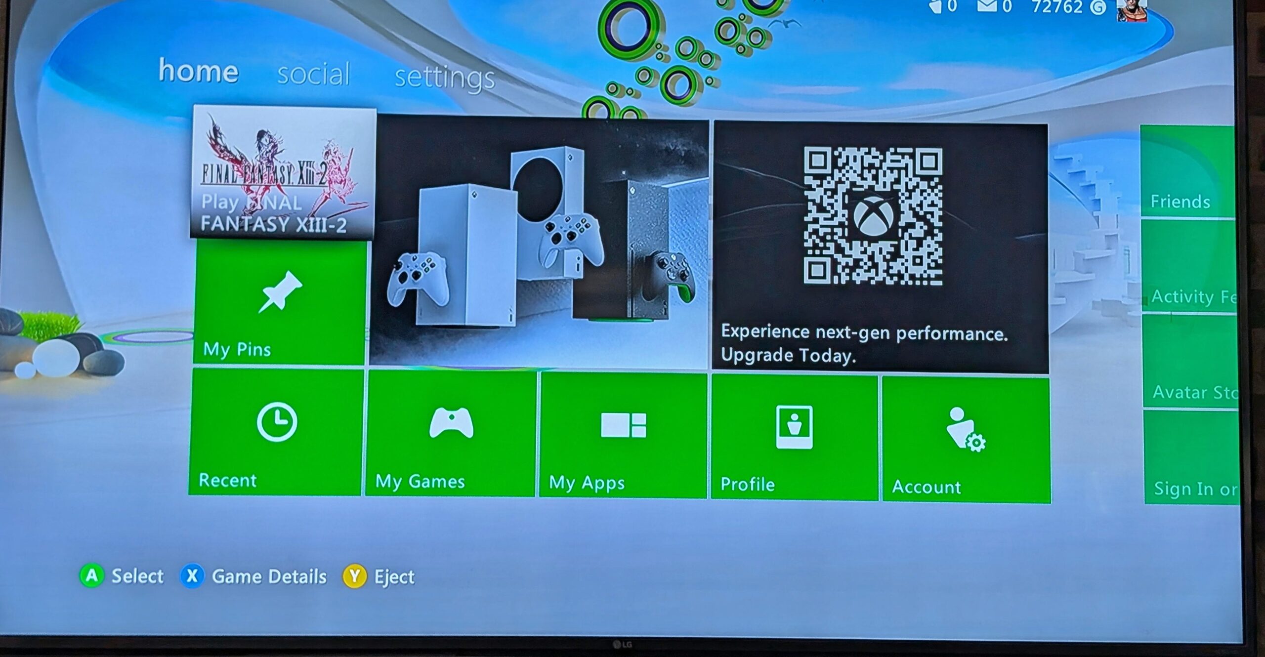 A photo taken of a TV displaying the Xbox 360 dashboard showing new ads.