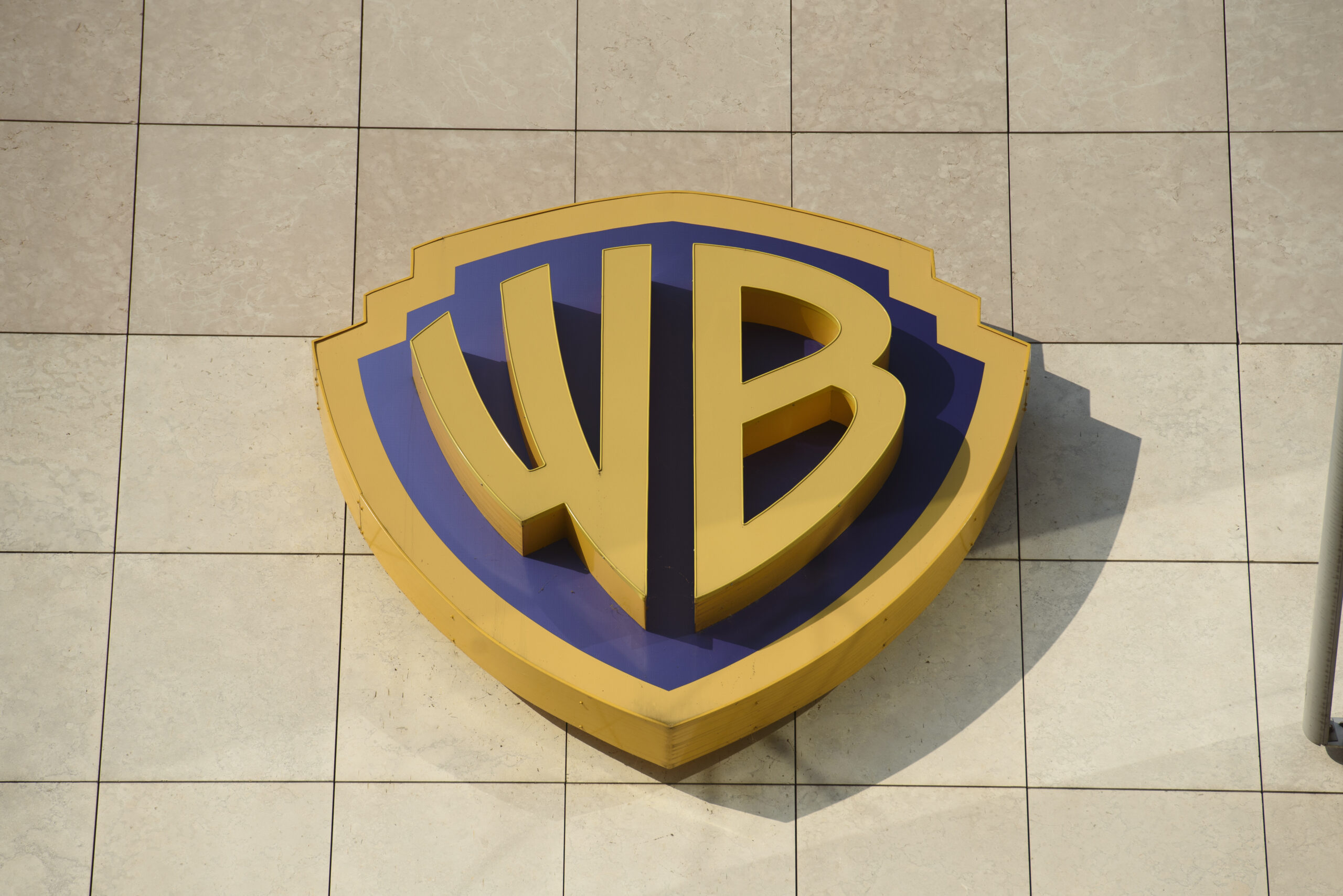 A photo showing the WB logo on a building