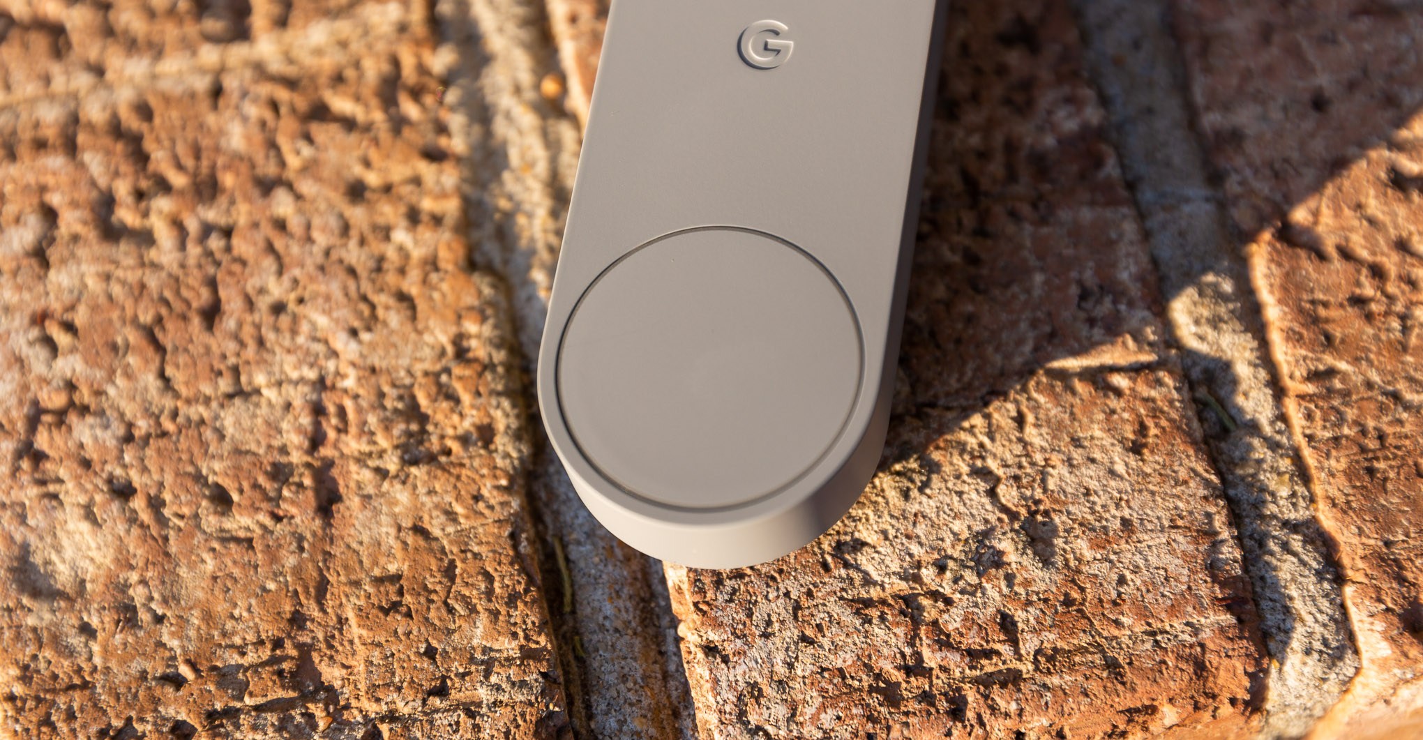 Close-up of the button at the bottom of the Nest doorbell