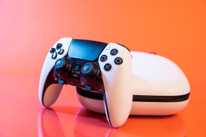 A picture of the DualSense Edge leaning on its included hard zip-up case.