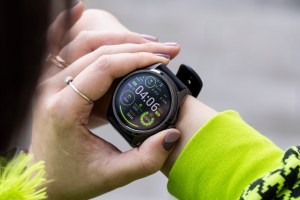 Close-up of person pressing the TicWatch Pro 5’s digital crown