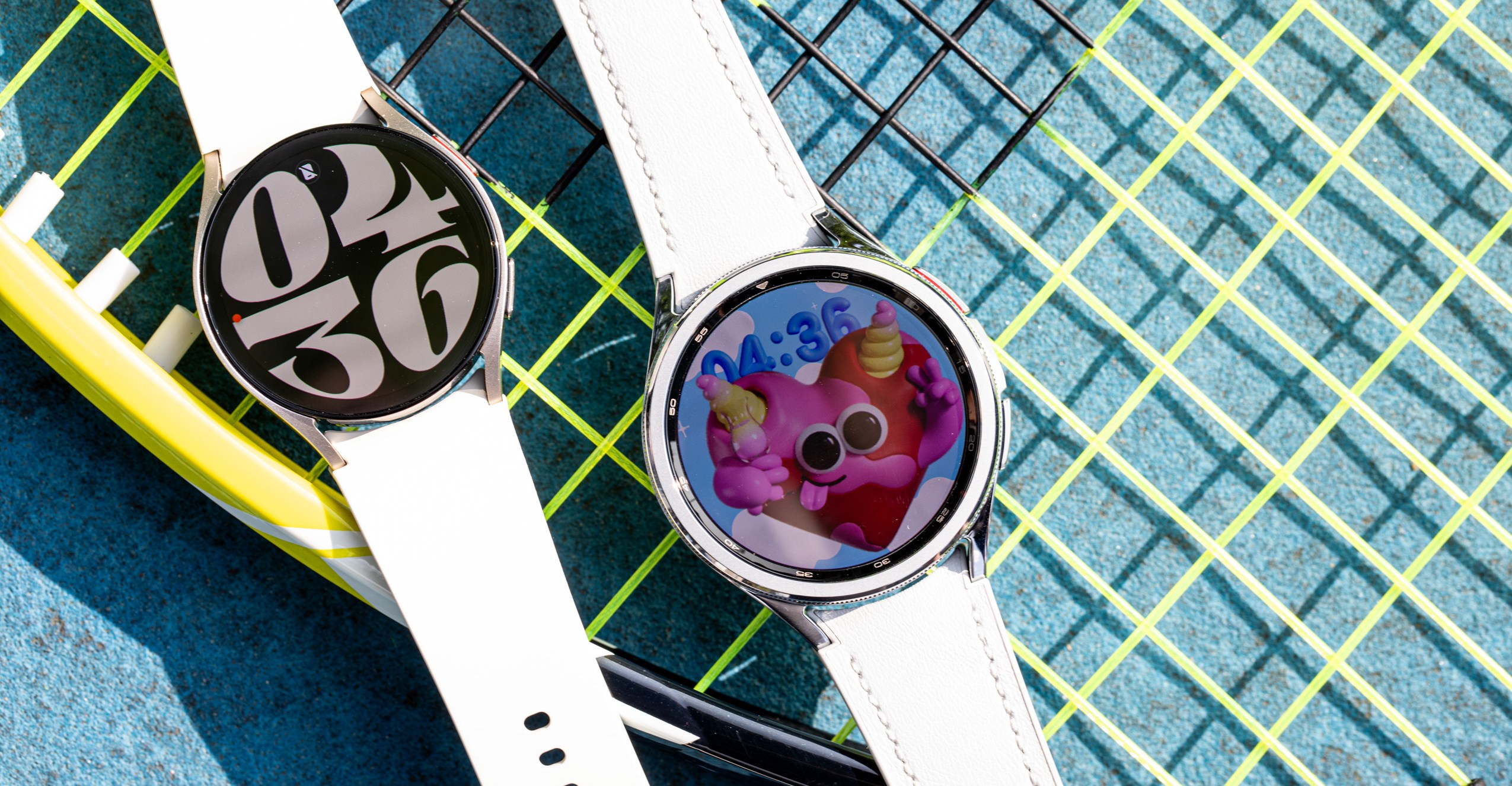Samsung Galaxy Watch 6 and Watch 6 Classic on top of a tennis racket
