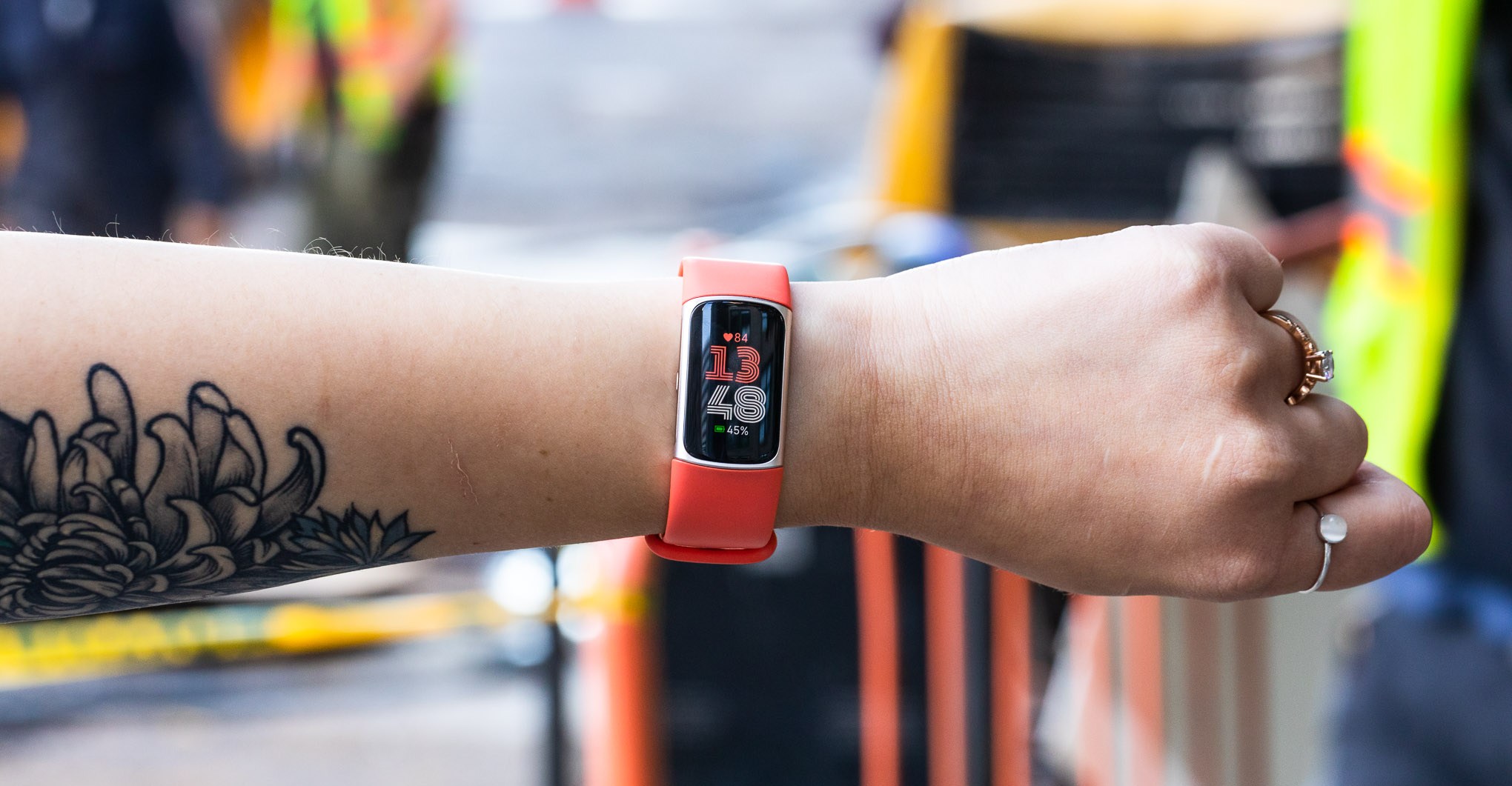 Person wearing Fitbit Charge 6 on outstretched arm.