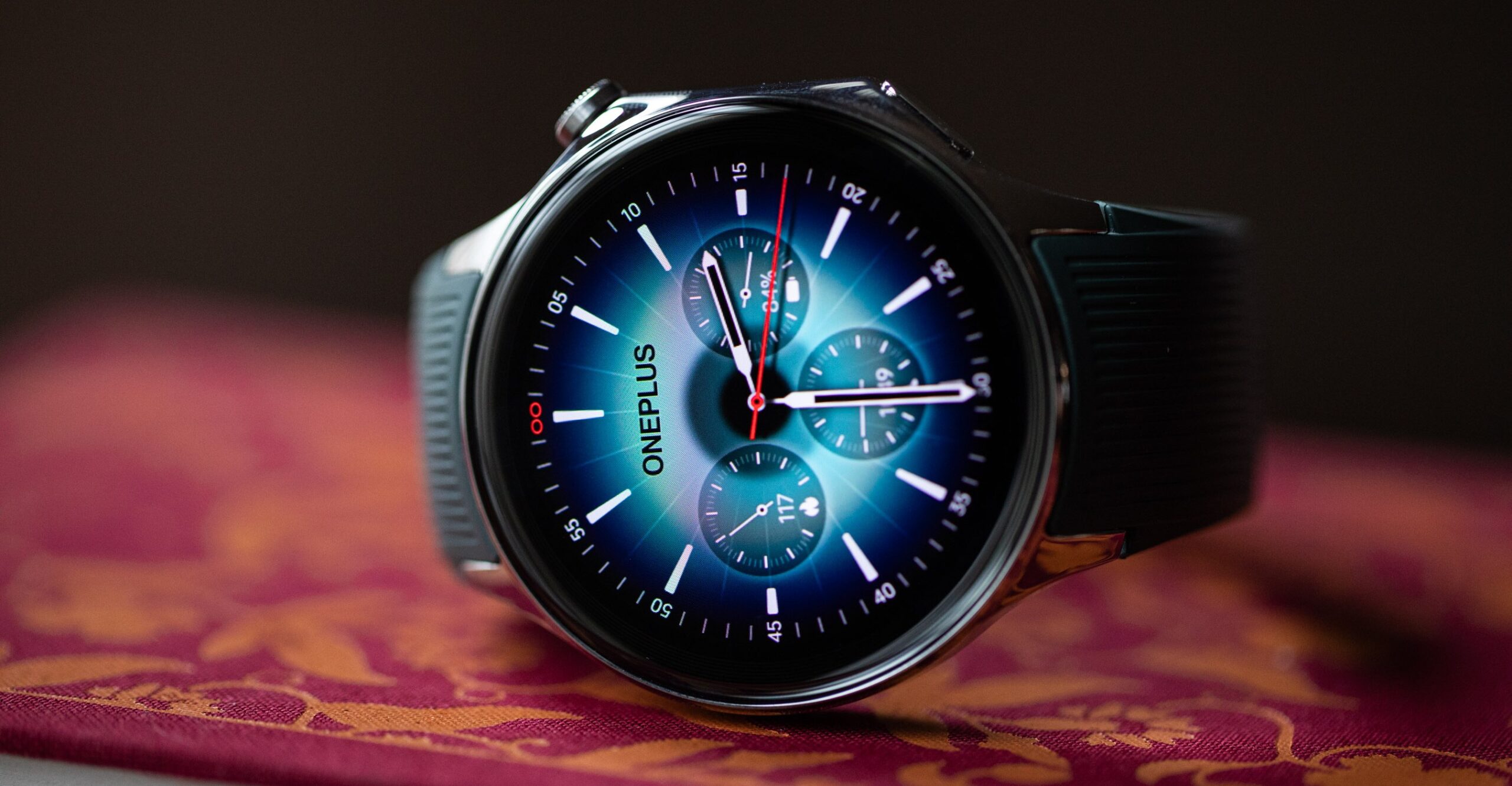 Close-up of the OnePlus Watch 2 on a red book