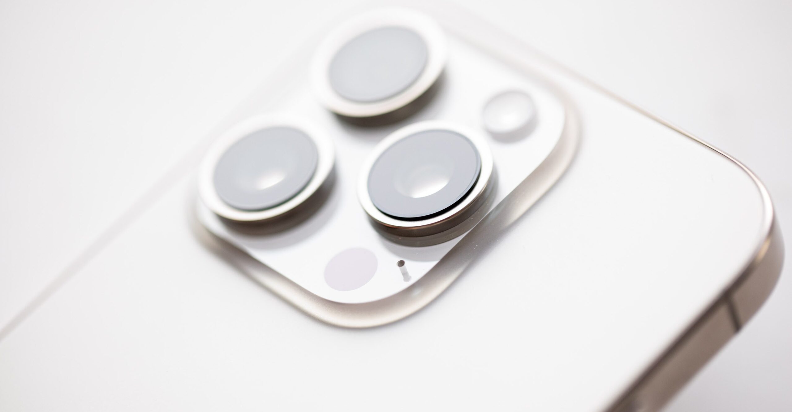 Photo of iPhone 16 Pro in white on a white background.