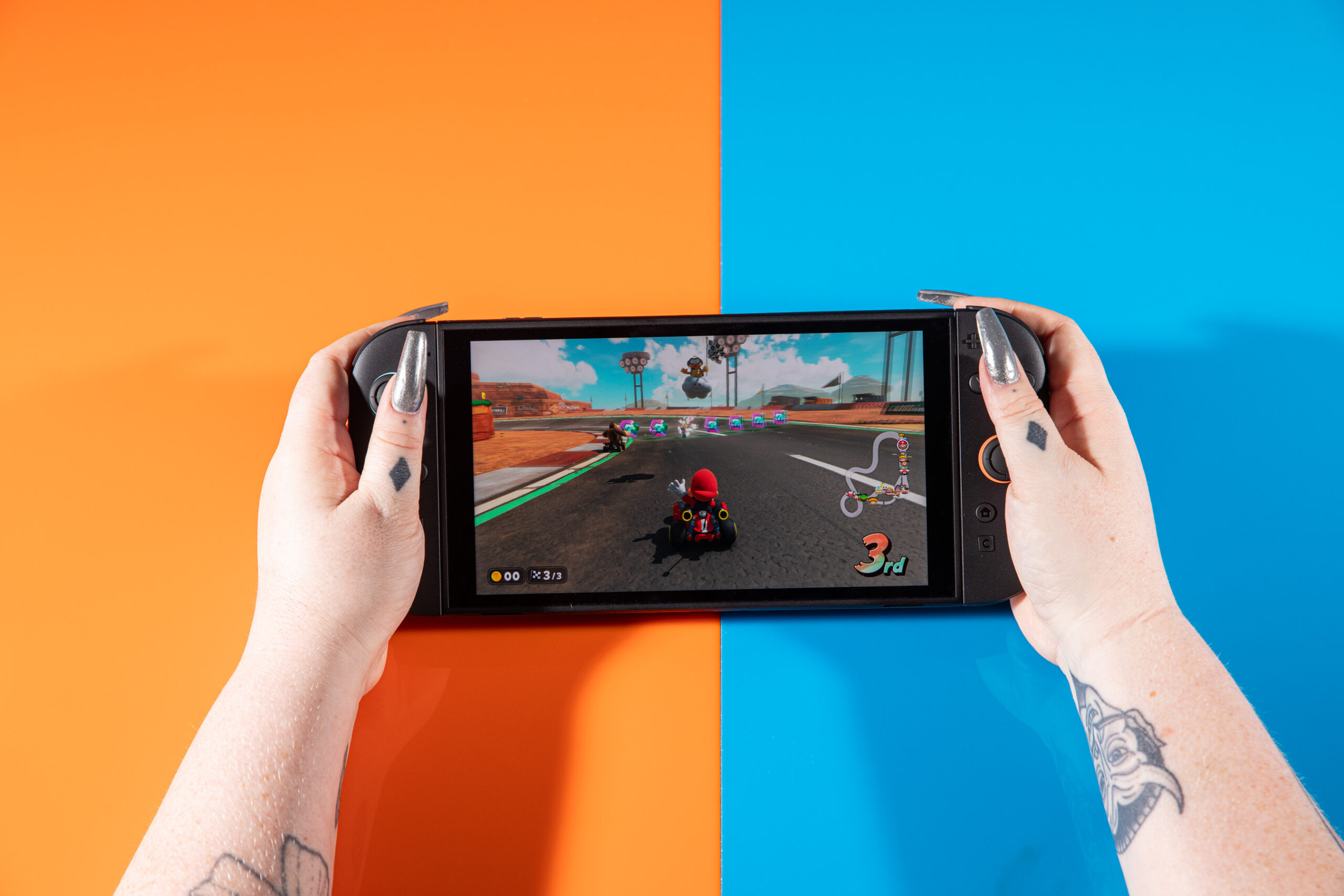 A pair of hands holding the Nintendo Switch 2.