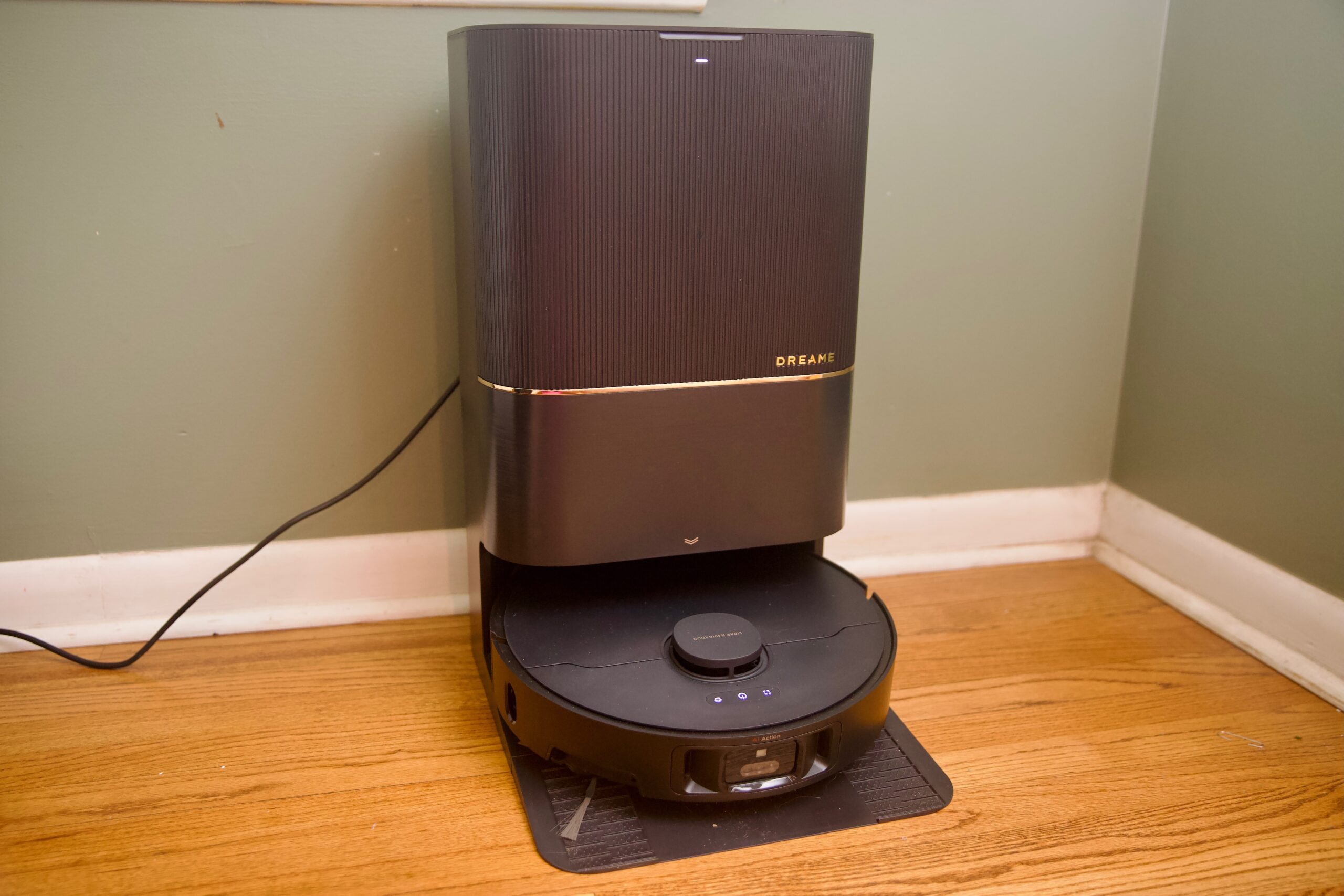 The Dreame X40 Ultra resting against a wall.
