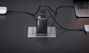 The Anker Prime 100W GaN Wall Charger (3 Ports) connected to three devices.