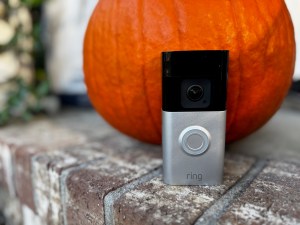 The Ring Battery Doorbell Pro in front of a pumpkin.