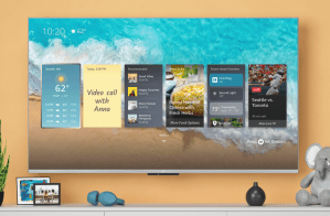 An image of Amazon’s Fire TV Omni QLED television on a wall with onscreen widgets for weather, sticky notes, music, and more.