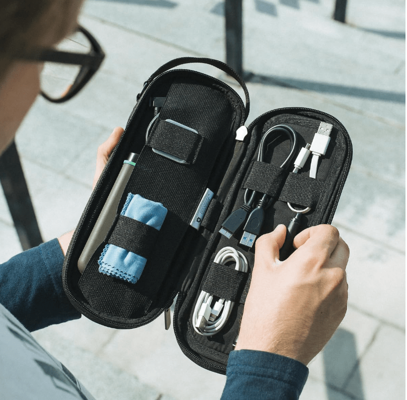 A black case with various cords inside.