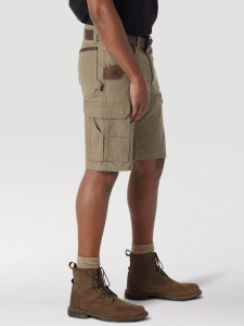 Bottom part of person wearing tan shorts