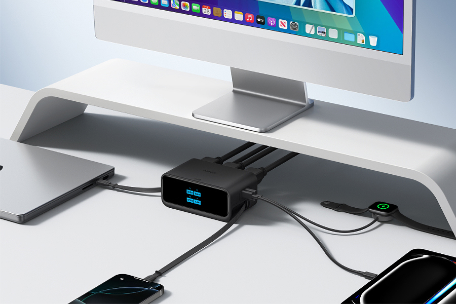 Anker’s 7-in-1 Nano Charging Station connected to several devices on a desk with a computer.