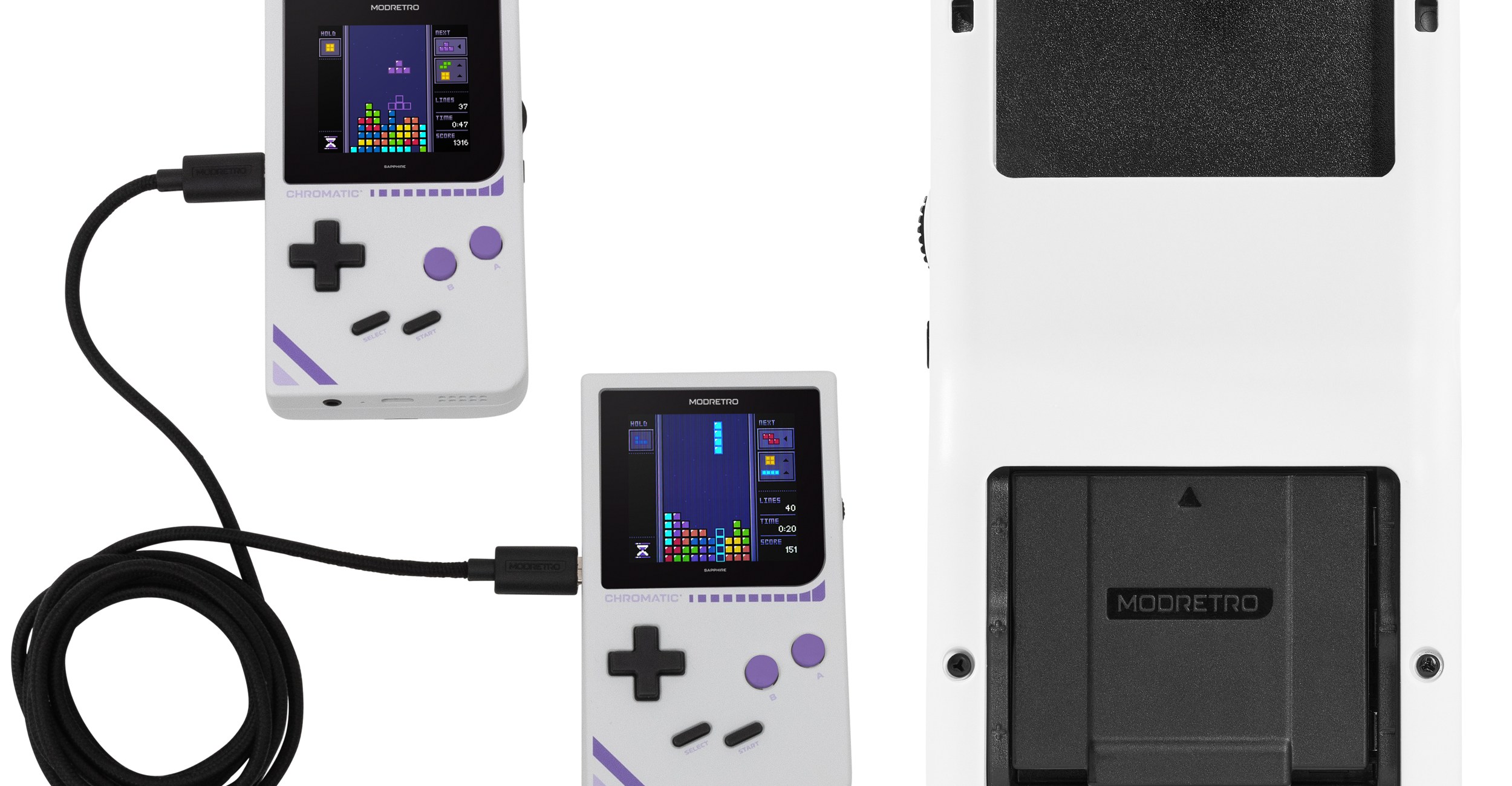 Two Chromatic handhelds connected by a link cable next to a Chromatic that’s flipped over with a rechargeable battery pack inserted.