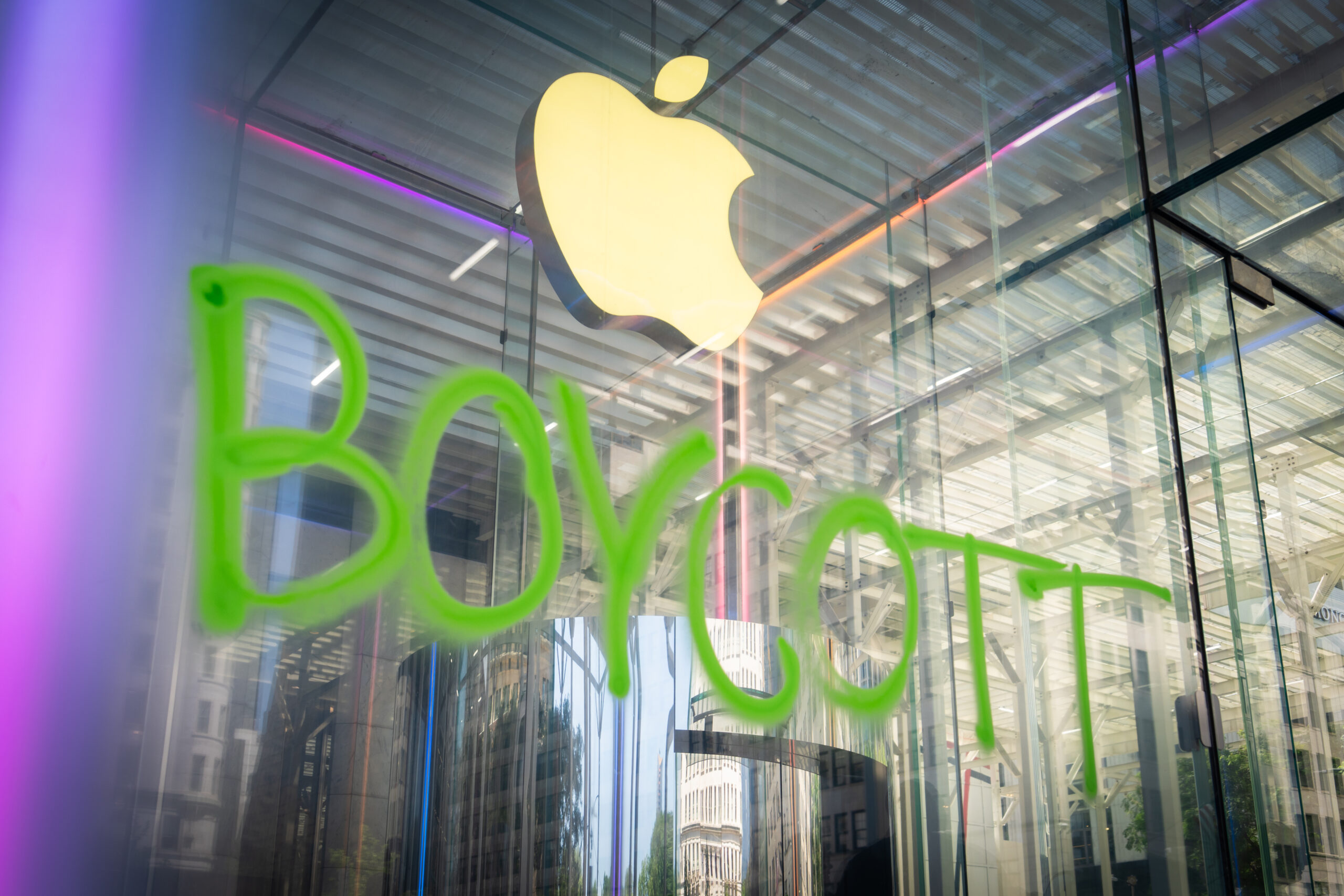 An image of the word “Boycott” spray-painted on the Apple Store in New York City