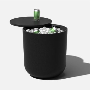 A cooler / table with the top open showing ice and cans.
