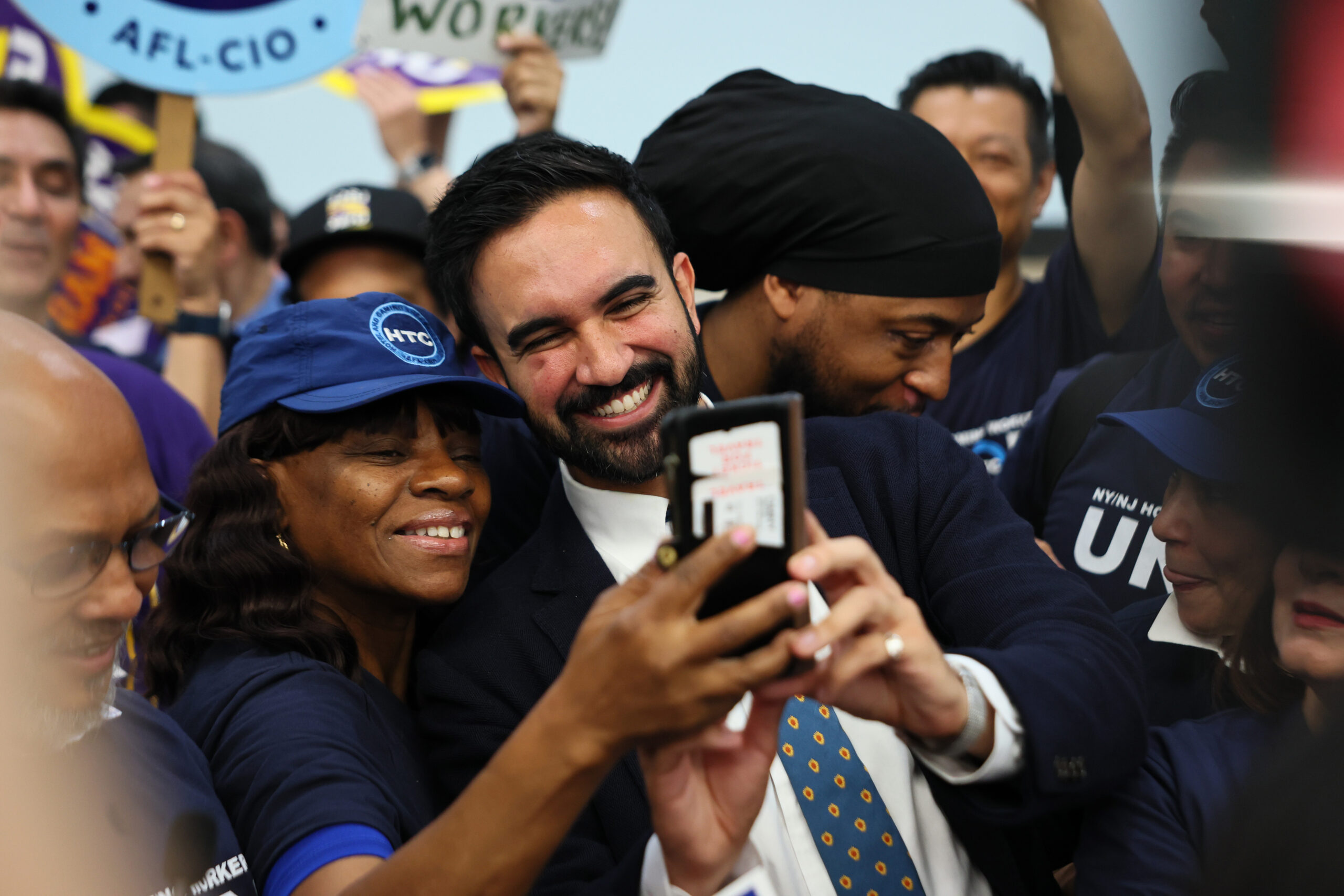 NEW YORK, NEW YORK – JULY 02: New York Mayoral Candidate Zohran Mamdani takes photos with supporters during a press conference at the Hotel & Gaming Trades Council building on July 02, 2025 in New York City. Mamdani celebrated his mayoral primary victory with leaders and members of the city’s labor unions, including the Hotel and Gaming Trades Council, 32BJ SEIU, New York State Nurses Association, and NY City Central Labor Council, and received the endorsements of these unions. (Photo by Michael M. Santiago/Getty Images)