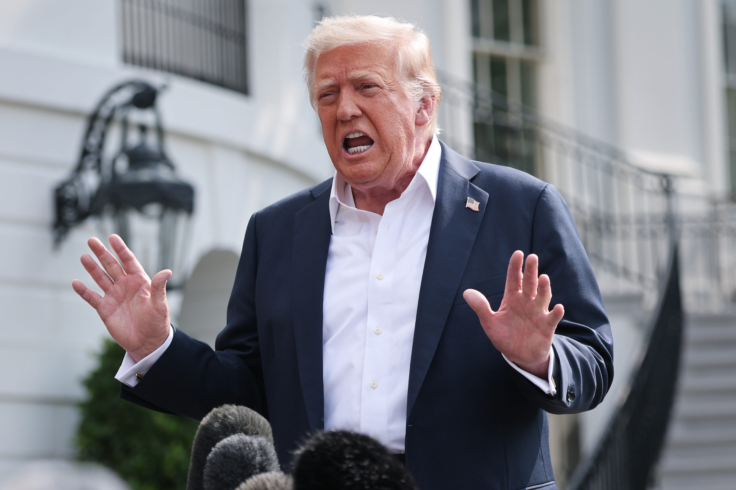 WASHINGTON, DC – JULY 11: U.S. President Donald Trump answers questions while departing the White House on July 11, 2025 in Washington, DC. Trump is scheduled to travel to Central Texas today to meet with first responders and local elected officials involved with the recovery process from last week’s flash flooding event that has claimed more than 120 lives. (Photo by Win McNamee/Getty Images)