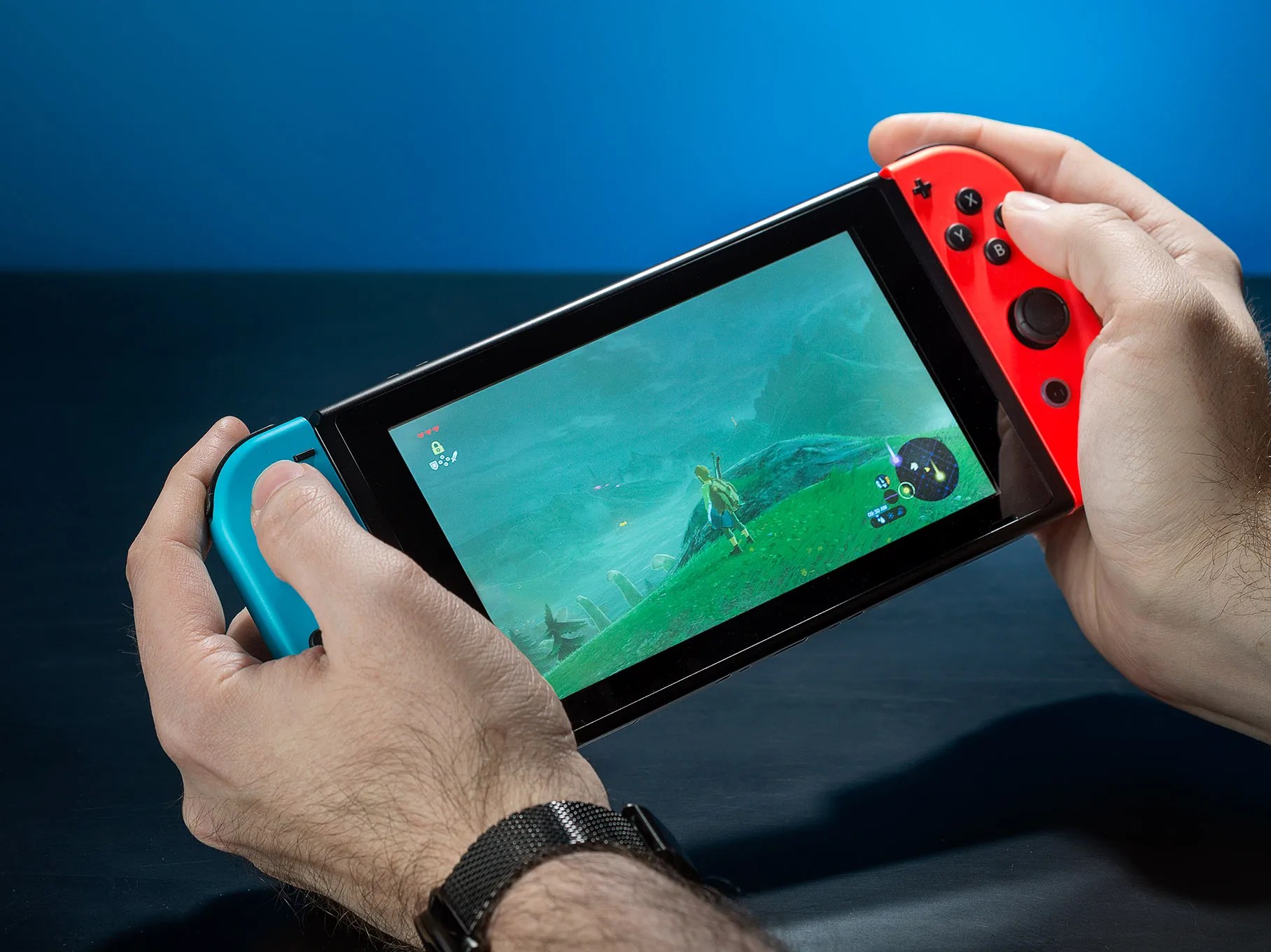 A photo of someone holding the Switch 