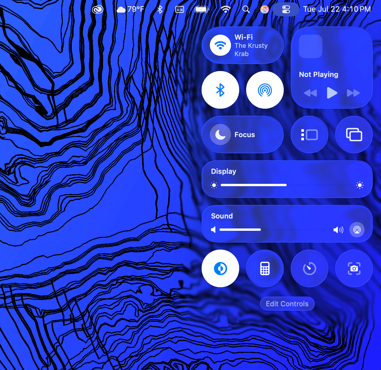 A close-up of Control Center opened on a MacBook running macOS Tahoe 26 developer beta 4.