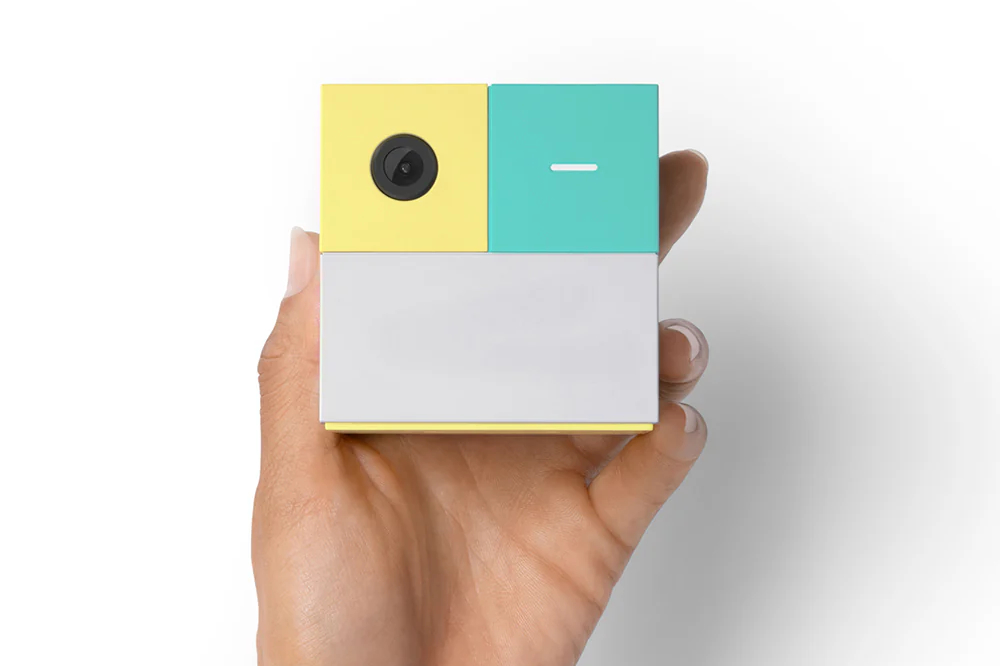 An image of a person holding the Nex Playground console in their hand.