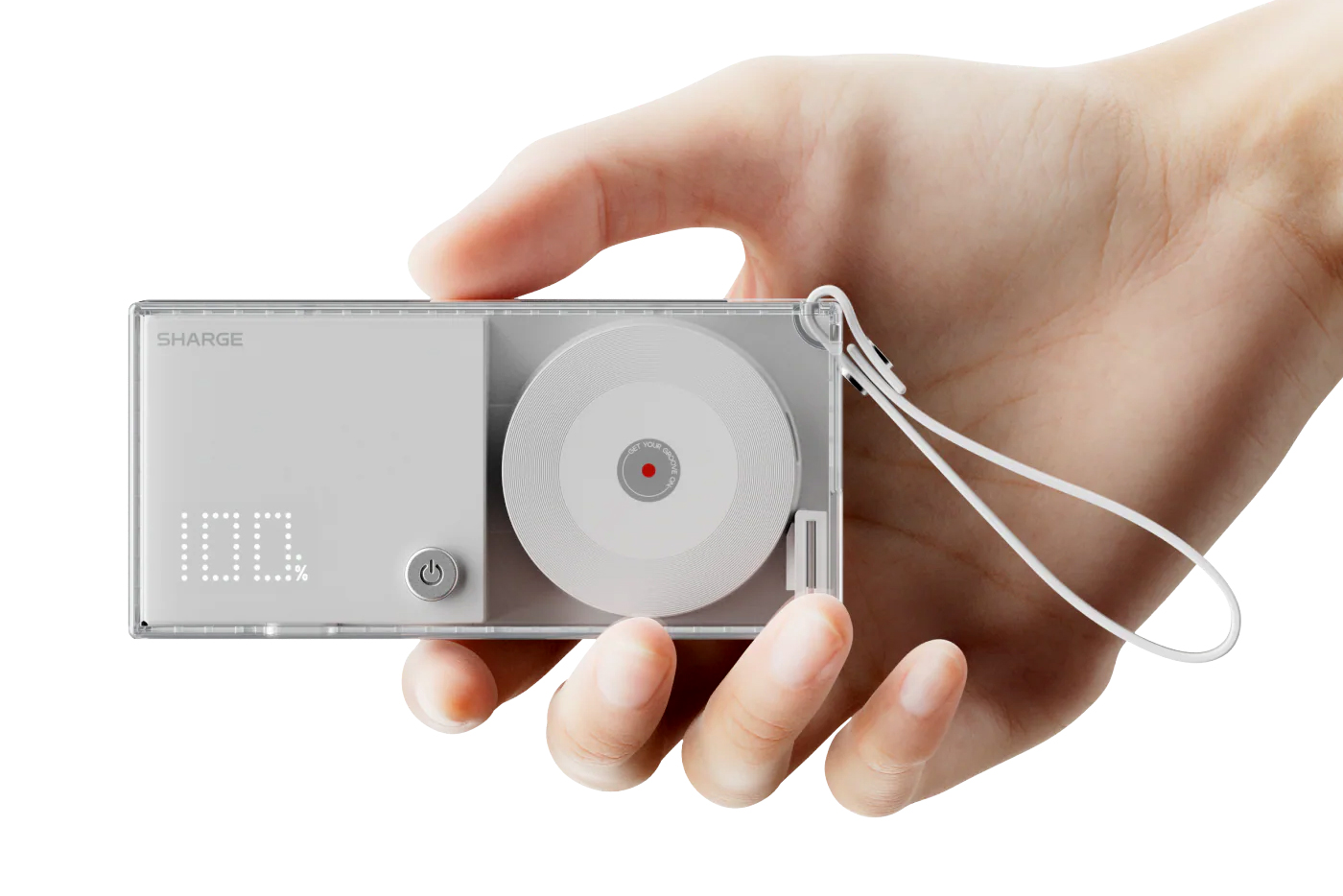 A hand holds Sharge’s 3-in-1 power bank charger.