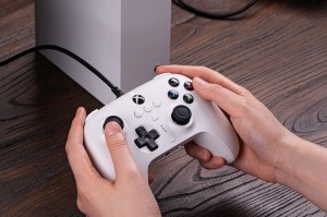 Someone playing on Xbox with 8BitDo Ultimate wired controller