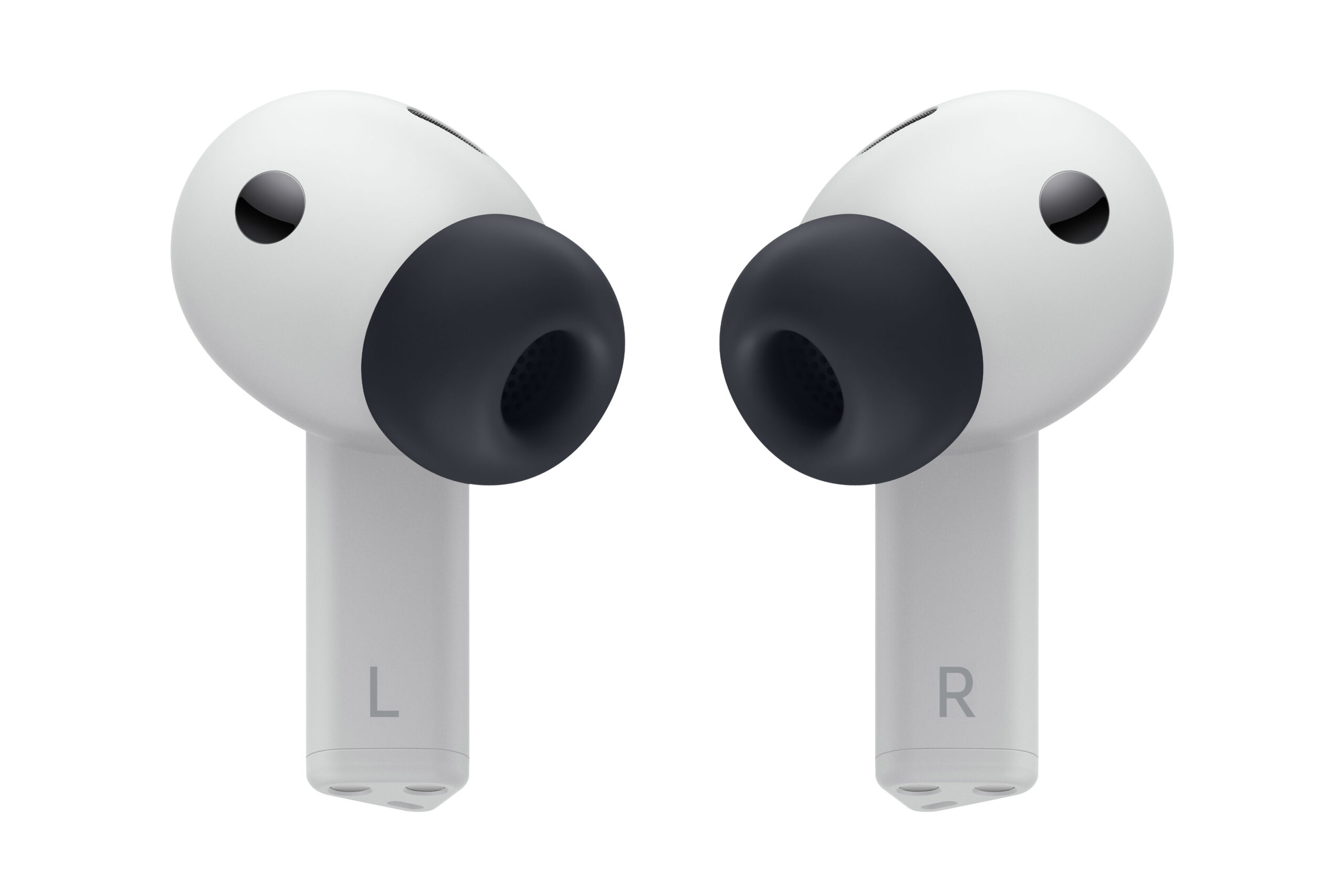 Left and right earbuds showing the letters “L” and “R” printed on the stems, isolated against a blank background.