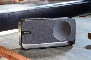 A hands-on photo of Bose’s SoundLink Home Bluetooth speaker on a table.