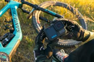 A person holding the GoPro Hero 13 Black outside.
