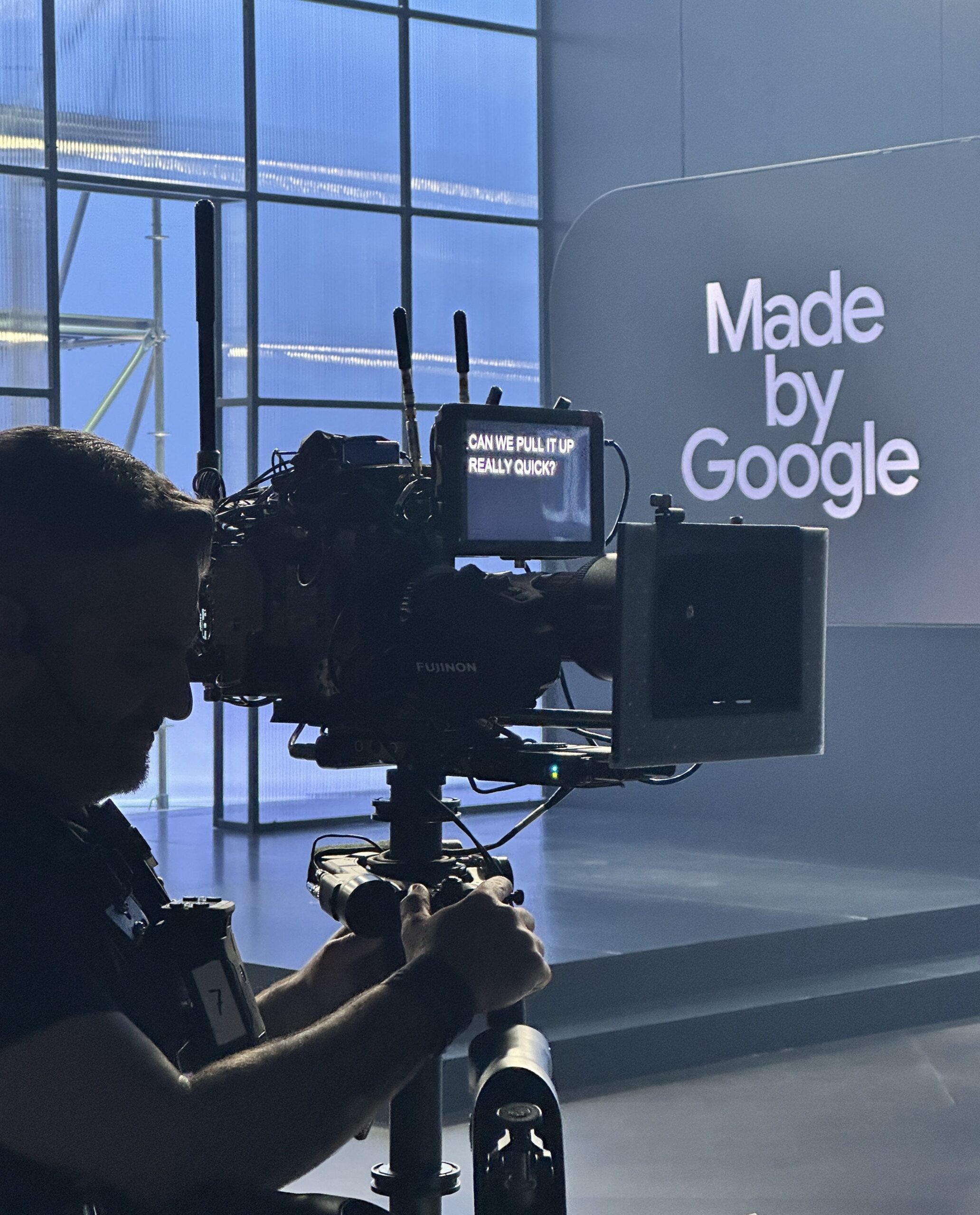 Close up of camera person holding a teleprompter with a script of the Made by Google event.