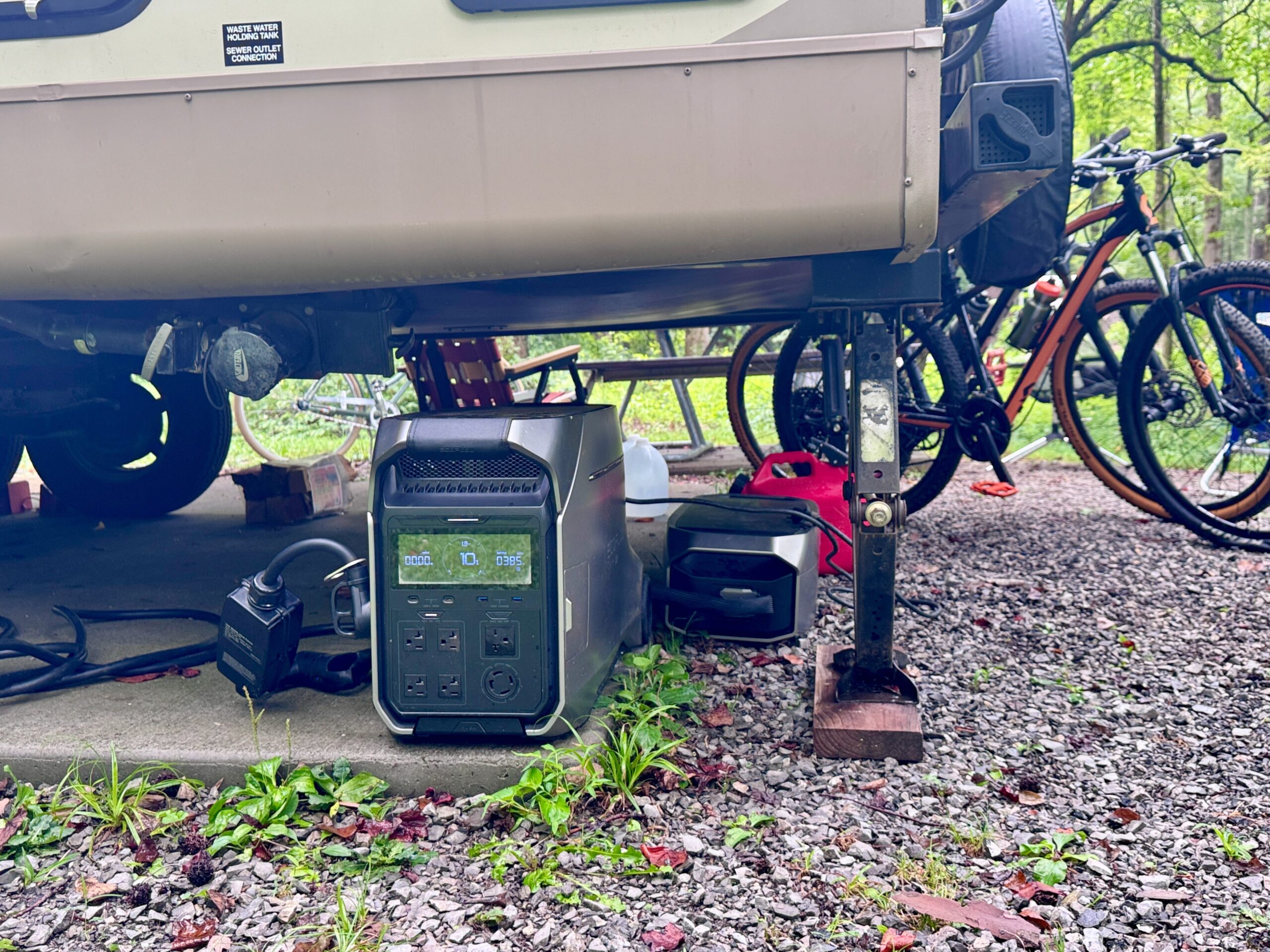 A portable power station underneath an RV.