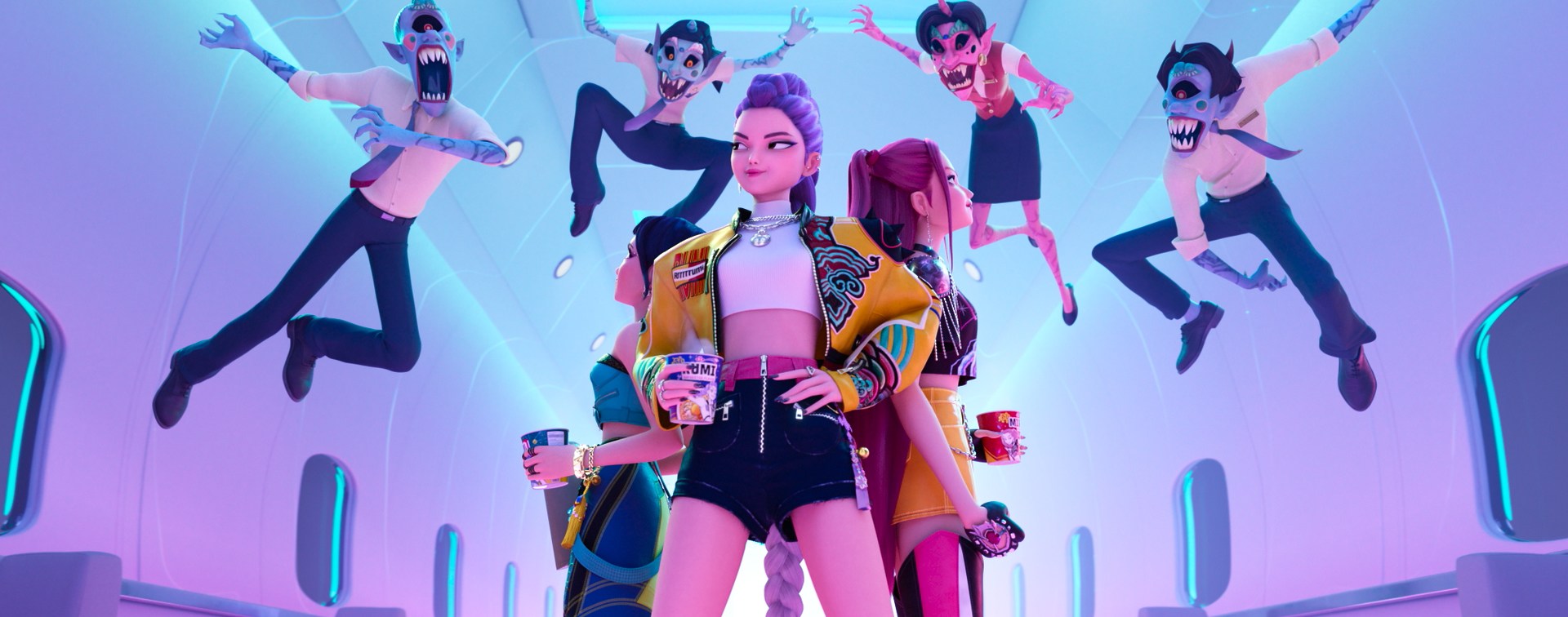 A group of three women standing back to back in the aisle of an airplane as four demons leap at them to attack.