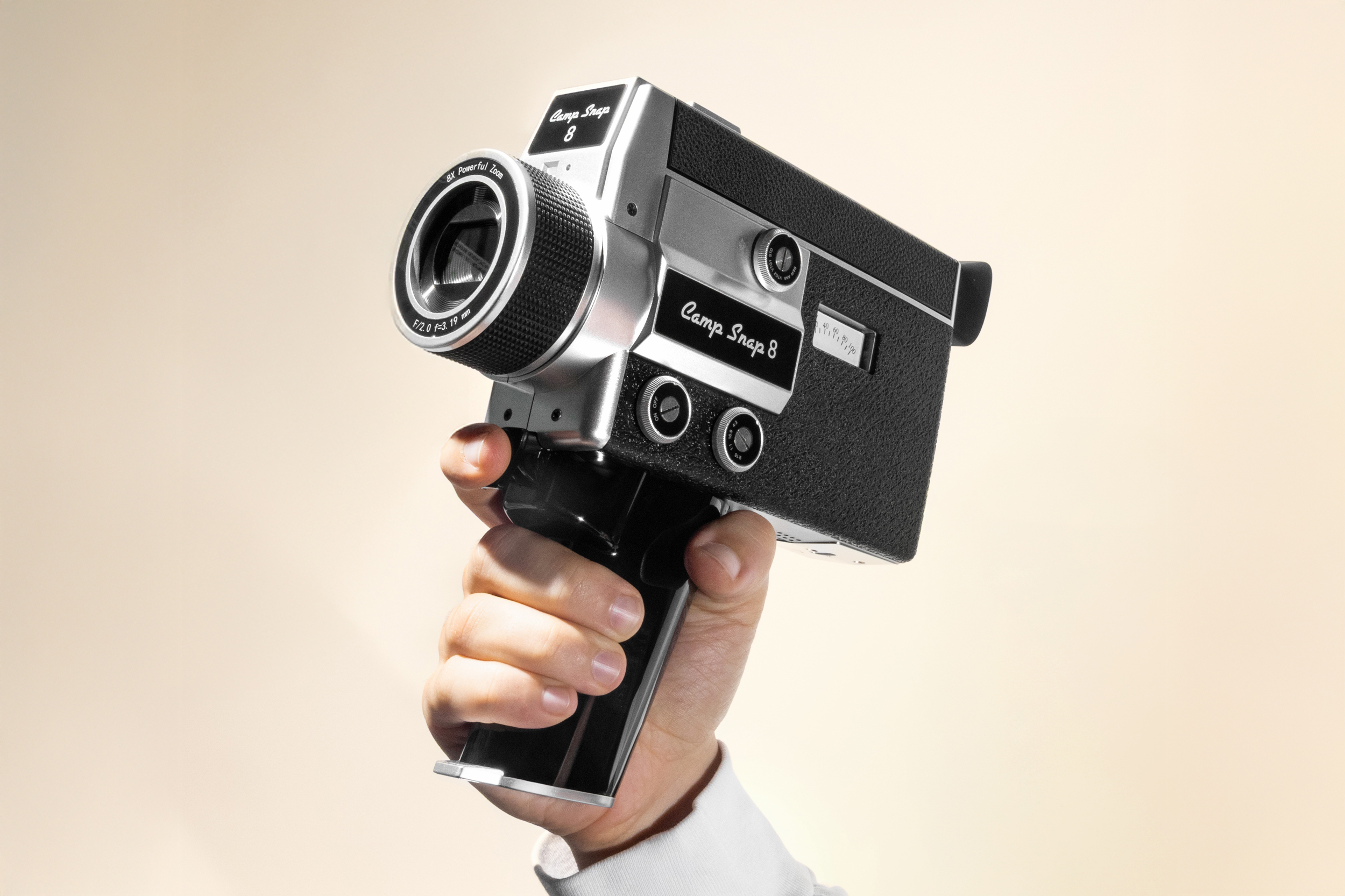 A hand holds the CS-8 Digital Video Camera in one hand.