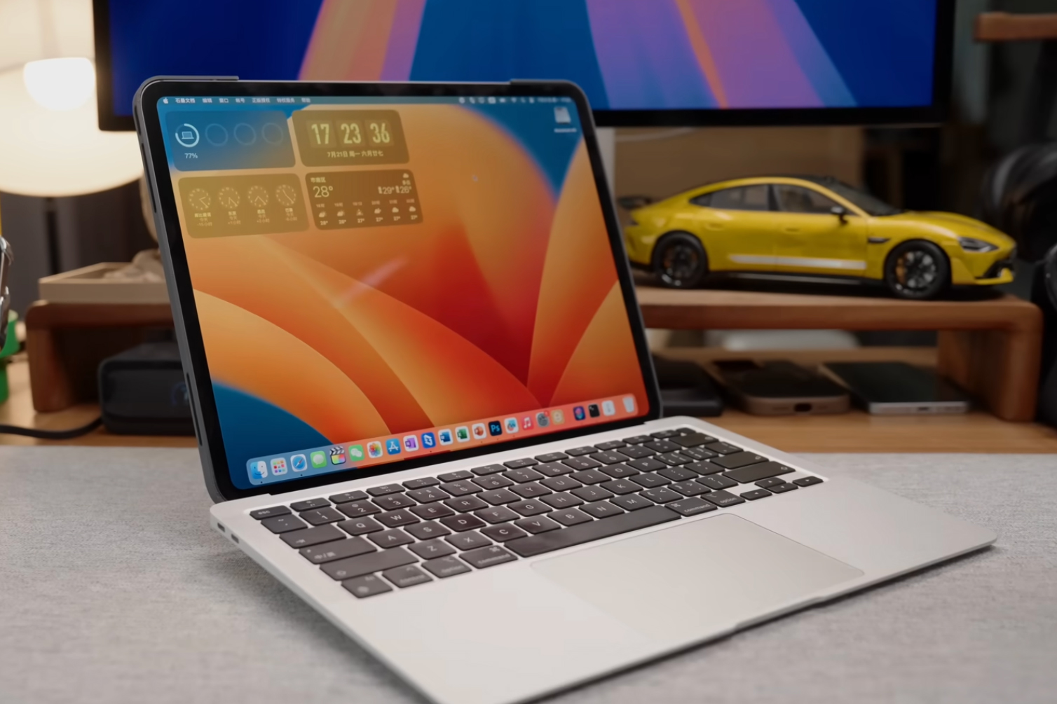 A custom MacBook Air iPad Pro hybrid laptop on a desk.