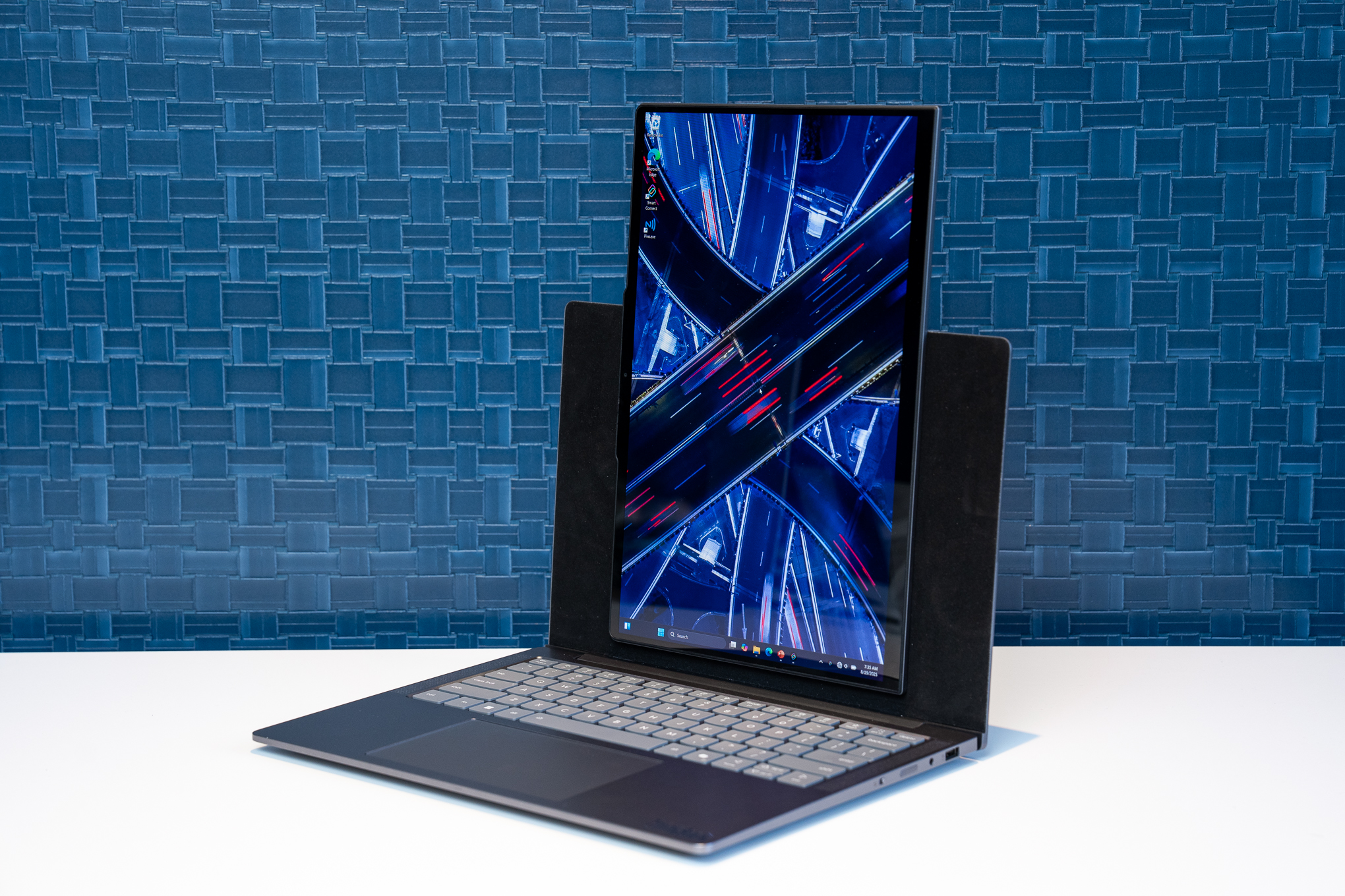 The Lenovo VertiFlex Concept laptop with its screen pivoted into portrait orientation, resting on a white surface.